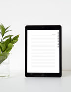 Digital tablet with a note-taking app on a white surface with a plant.