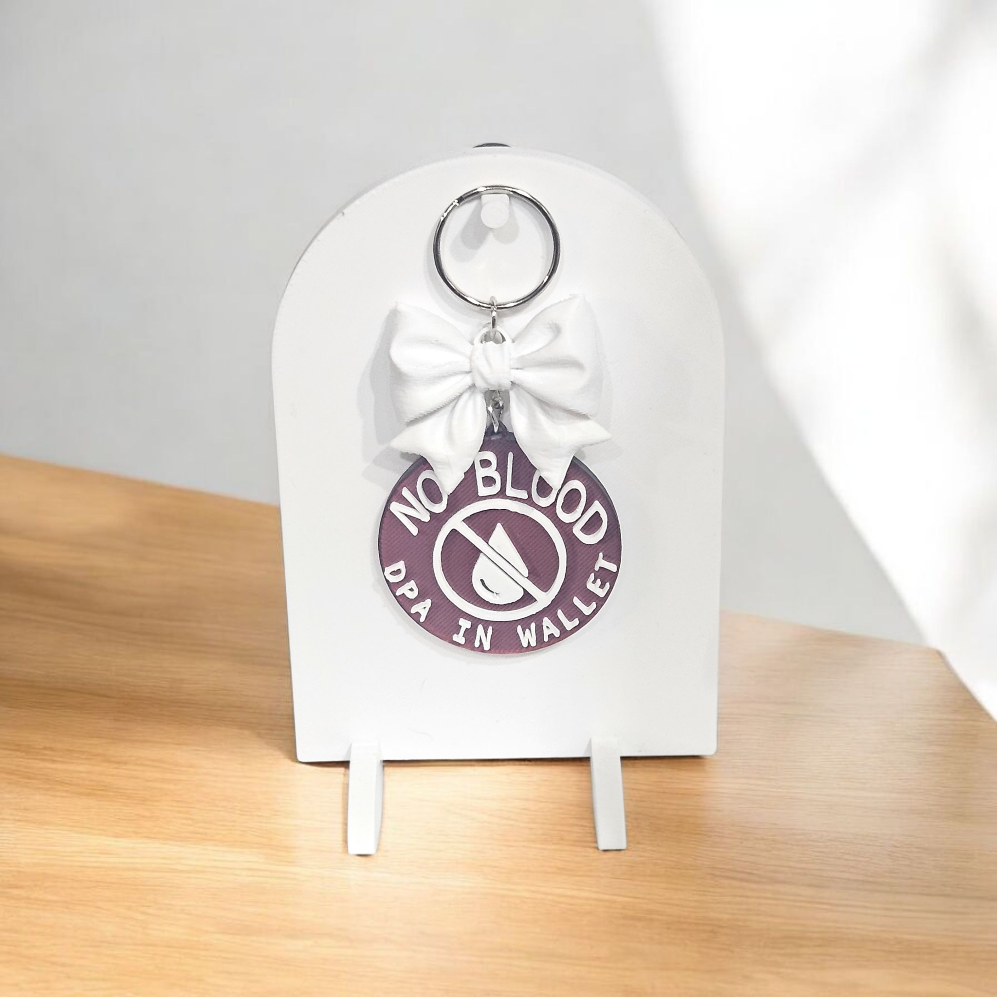 Deep red “No Blood – DPA in Wallet” 3D printed keychain with bow, silk finish, lightweight and durable medical ID accessory for JW ministry and everyday use