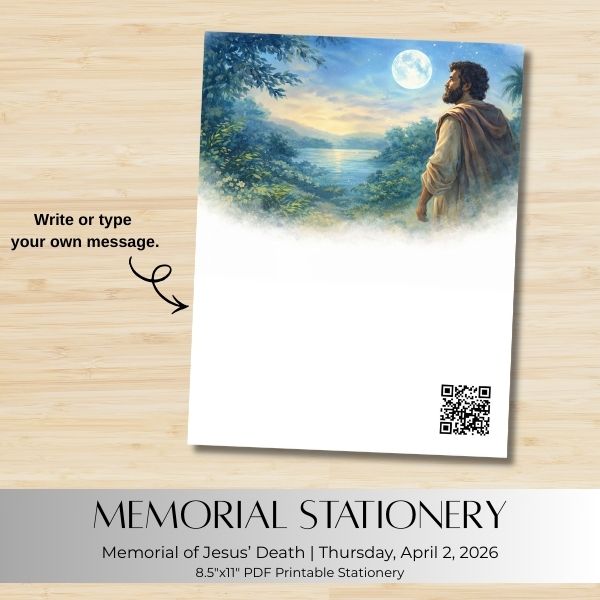 Memorial stationery with a painting of a man by a lake under a moonlit sky, on a wooden surface.