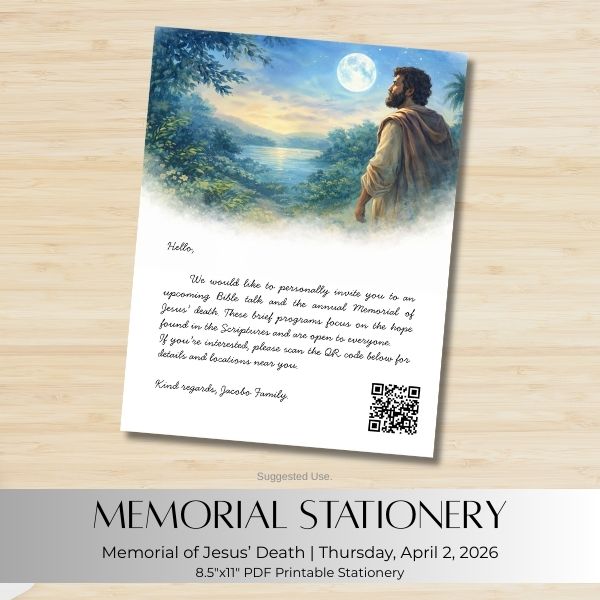 Memorial stationery with a scenic design and text on a wooden surface