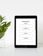 iPad displaying an attendance schedule on a white surface with a plant.