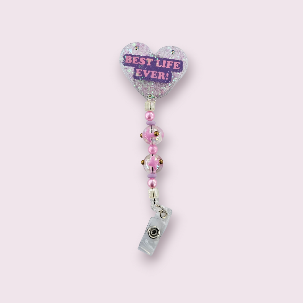 Hand-poured heart-shaped glitter resin badge reel with Best Life Ever inspirational message, pink glitter and pink & gold accent beads, for JW pioneers